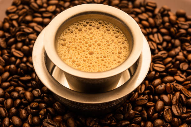 south indian coffee in jar and the beans around it 