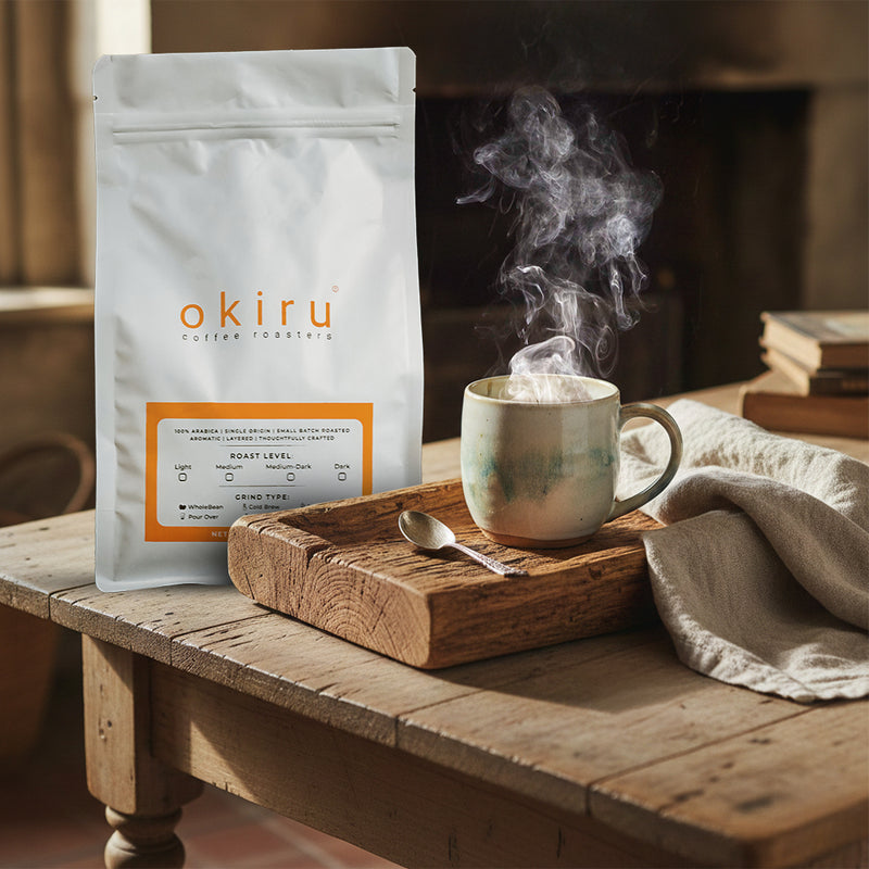 okiru coffee package with a steaming mug on a wooden table